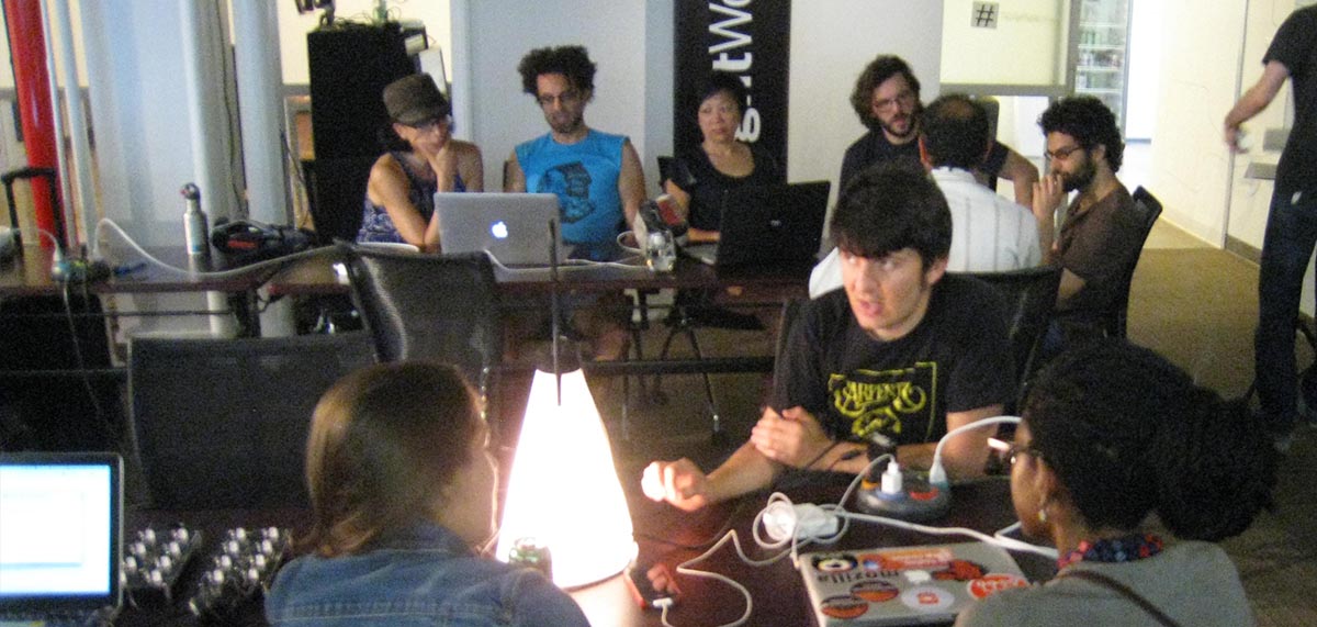 Artists and engineers hacking in the lab